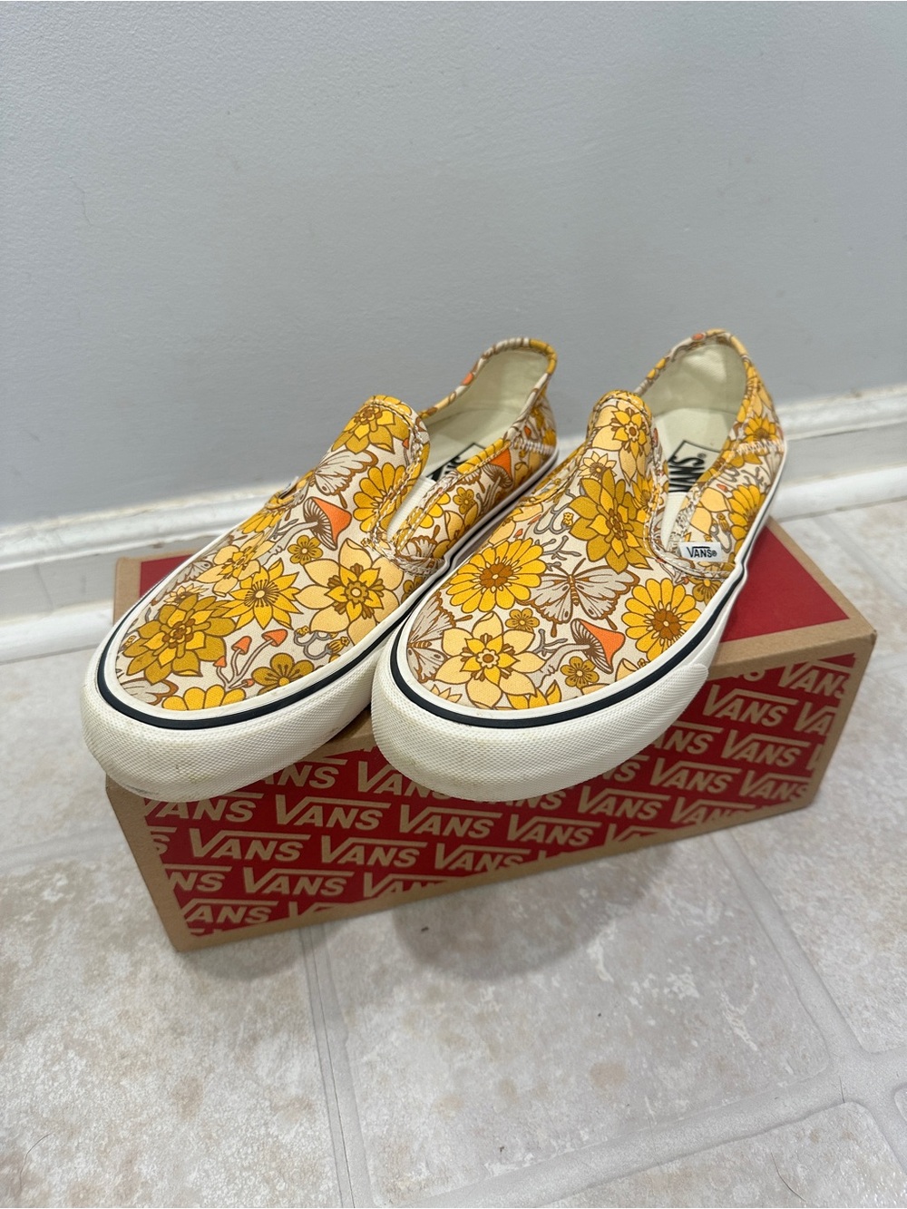 Vans Slip-On Floral Canvas Sneakers in Yellow and Orange